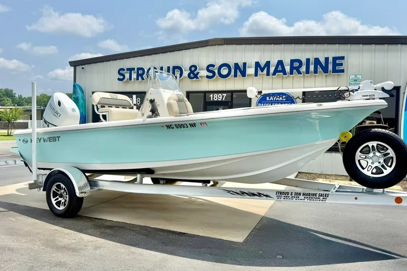 Slide: The Image of 2025 Key West 188 Bay Reef boat on trailer at Stroud & Son Marine dealership. - 4