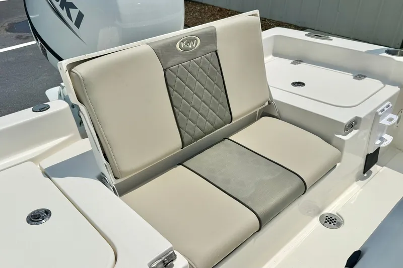 Slide: The Image of 2025 Key West 188 Bay Reef boat seat with elegant beige and gray upholstery. - 26