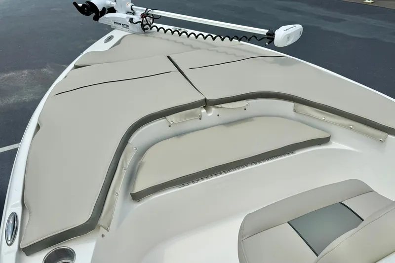 Slide: The Image of 2025 Key West 188 Bay Reef boat with cushioned seating and Minn Kota trolling motor. - 10