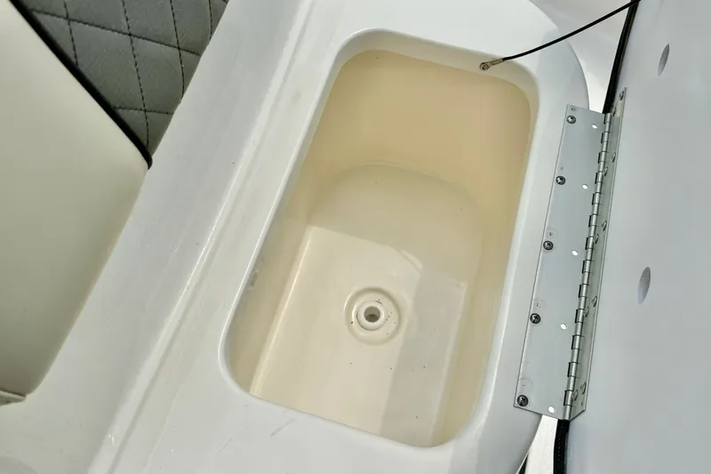 Slide: The Image of 2025 Key West 188 Bay Reef boat storage compartment with open lid. - 17