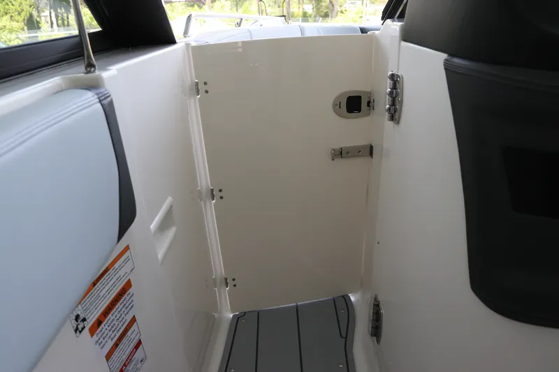 Slide: The Image of Interior view of 2026 Chaparral 280 OSX boat cabin door. - 35