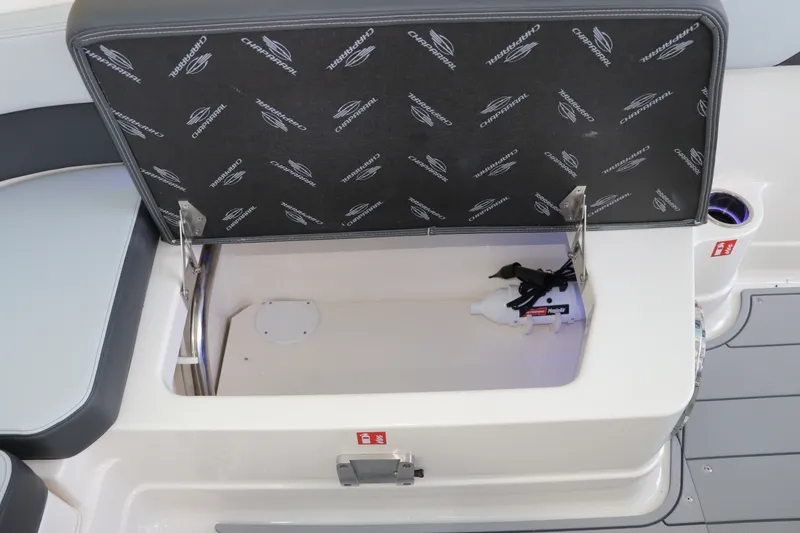 Slide: The Image of Open storage compartment on 2026 Chaparral 280 OSX boat, featuring branded interior. - 15