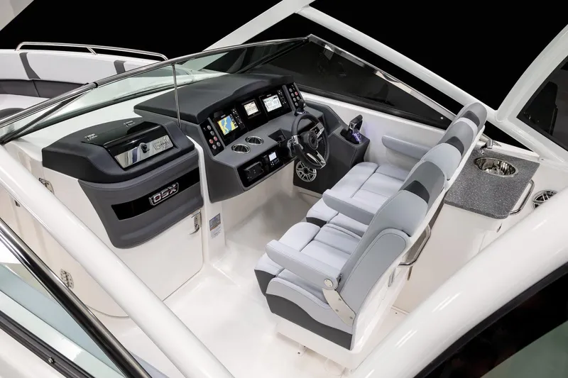 Slide: The Image of Manufacturer Provided Image: 2025 Chaparral 280 OSX boat interior with modern dashboard and seating. - 9