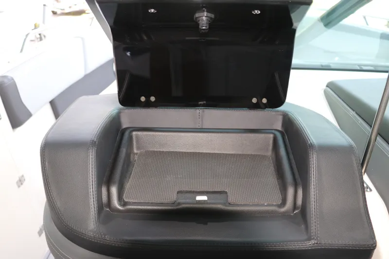 Slide: The Image of Open storage compartment on 2026 Chaparral 280 OSX boat interior. - 31