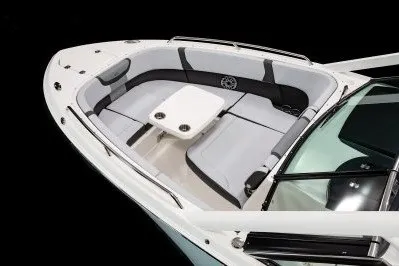 Slide: The Image of 2026 Chaparral 280 OSX boat interior with sleek seating and central table. - 13