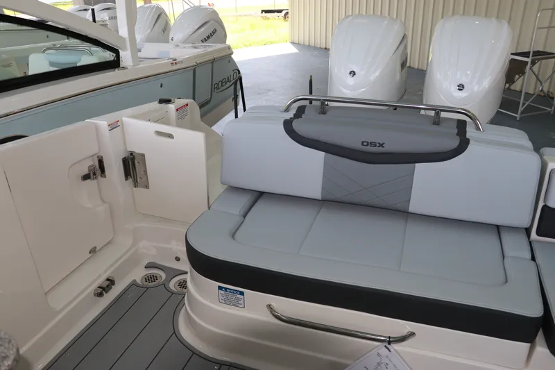 Slide: The Image of 2026 Chaparral 280 OSX boat interior with seating and Yamaha engines in background. - 11