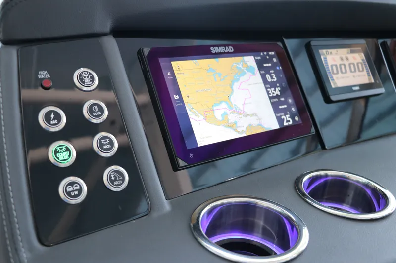 Slide: The Image of Dashboard of 2026 Chaparral 280 OSX with navigation display and control buttons. - 24