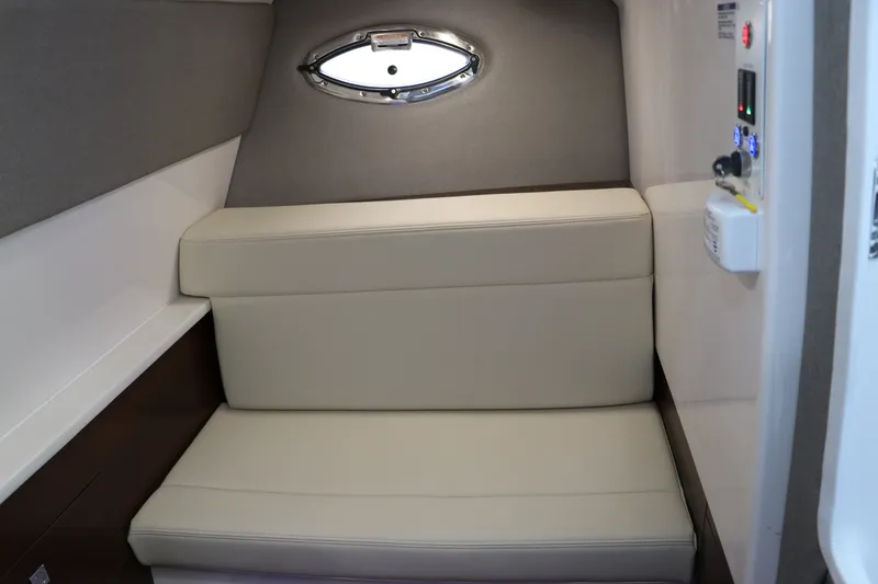 Slide: The Image of Interior seating area of 2026 Chaparral 280 OSX boat with porthole window. - 33