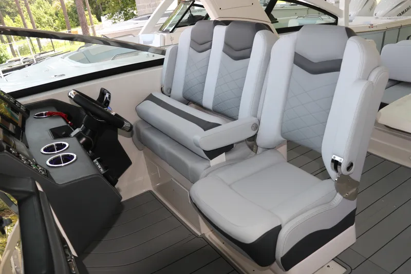 Slide: The Image of Luxury seating and helm of 2026 Chaparral 280 OSX boat interior. - 22