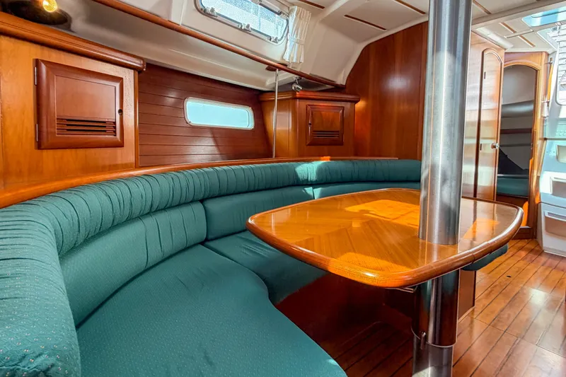 Slide: The Image of Luxurious interior of a 2002 Beneteau 361 yacht with elegant wood finishes. - 17