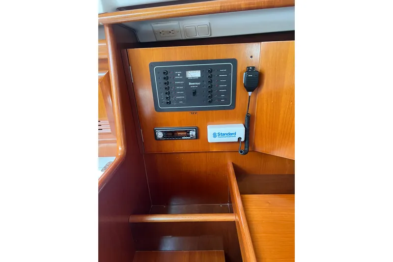 Slide: The Image of Control panel of a 2002 Beneteau Oceanis 361 sailboat with communication equipment. - 7