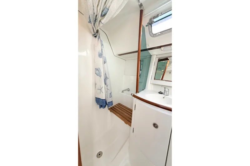 Slide: The Image of Bathroom interior of 2002 Beneteau 361 yacht with shower and sink. - 25