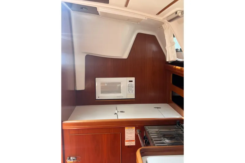 Slide: The Image of Interior of 2002 Beneteau Oceanis 361 yacht kitchen with microwave and stove. - 5