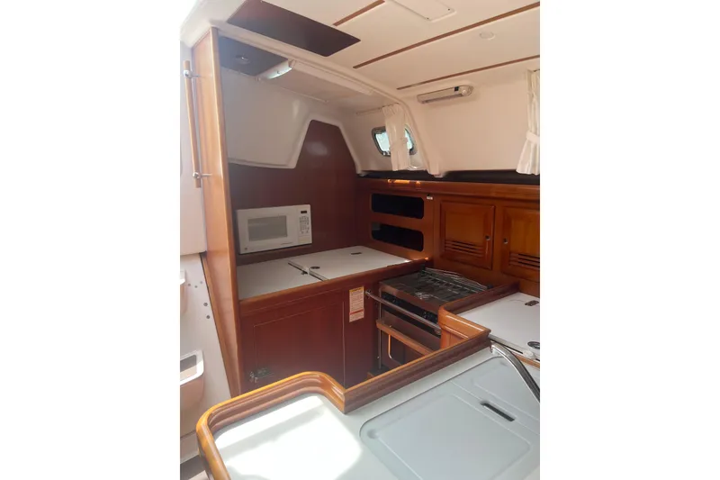 Slide: The Image of Interior of 2002 Beneteau Oceanis 361 yacht kitchen with microwave and stove. - 4