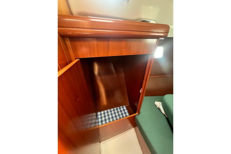 Slide: The Image of Wooden interior cabinet on a 2002 Beneteau Oceanis 361 sailboat. - 13
