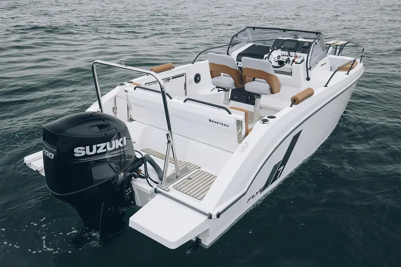 Slide: The Image of Manufacturer Provided Image: 2026 Beneteau Flyer 7 SUNdeck boat with Suzuki outboard motor on water. - 2