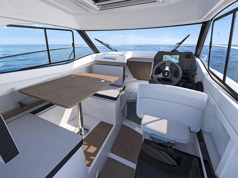 Slide: The Image of Manufacturer Provided Image: Interior of 2026 Beneteau Antares 7 boat with modern seating and navigation area. - 7