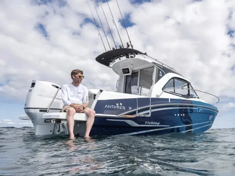 Slide: The Image of Manufacturer Provided Image: 2026 Beneteau Antares 7 boat on water, man seated, fishing rods visible. - 4