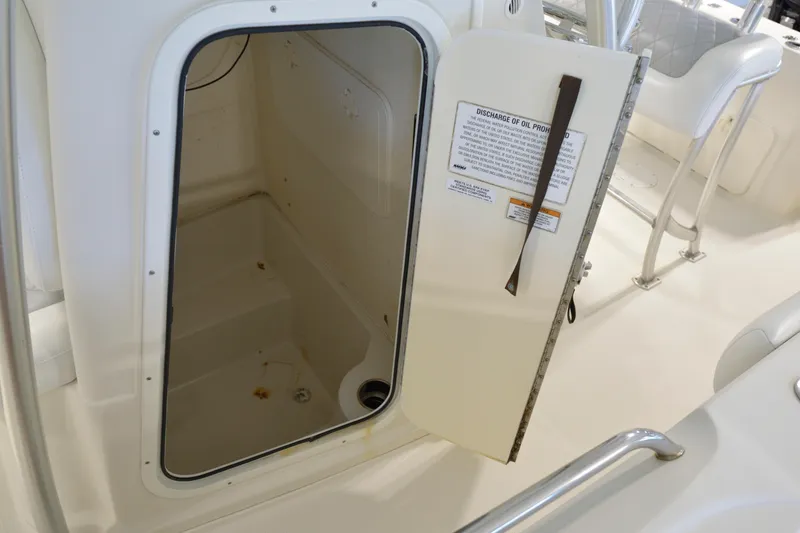 Slide: The Image of Open storage compartment on 2014 Sailfish 220 CC boat interior. - 13