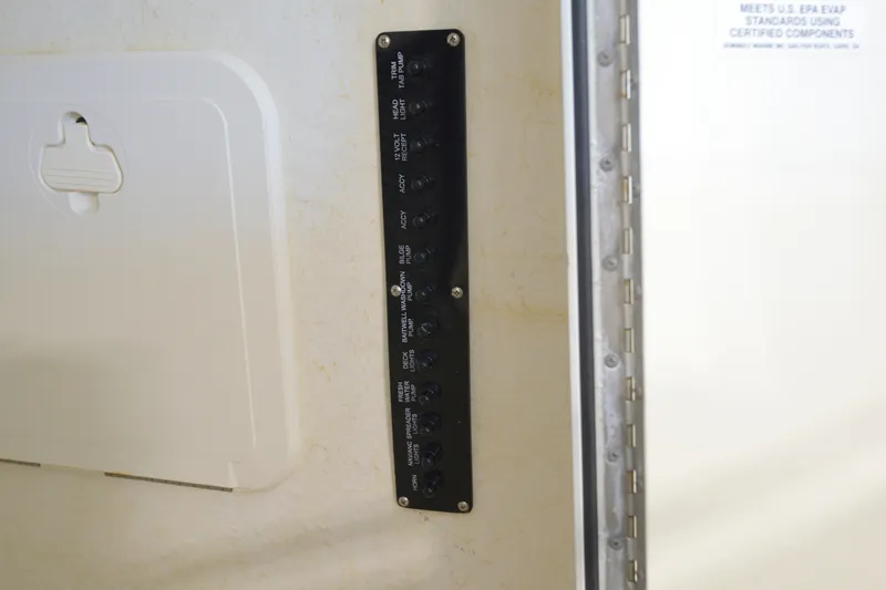 Slide: The Image of Control panel on a 2014 Sailfish 220 CC boat interior. - 14