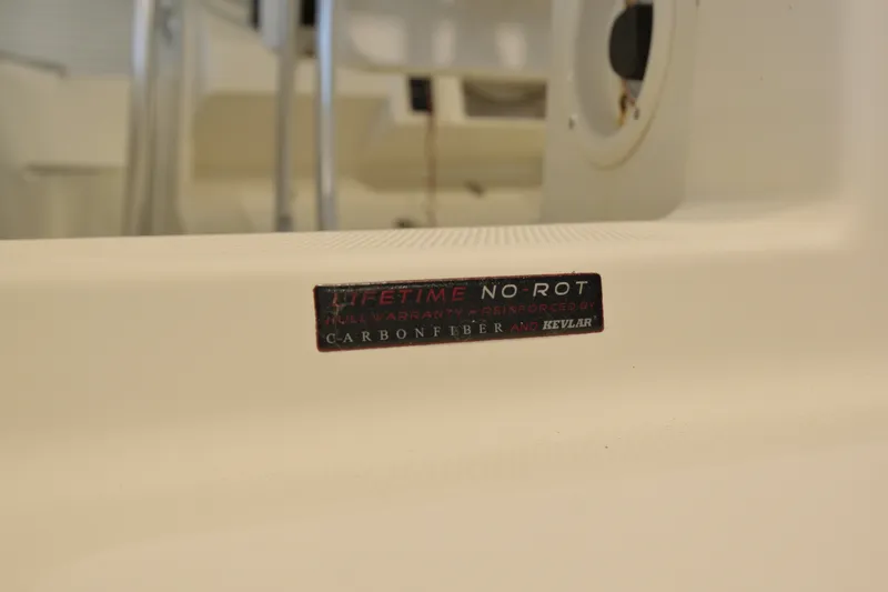 Slide: The Image of 2014 Sailfish 220 CC boat interior with "Lifetime No Rot" warranty label. - 8