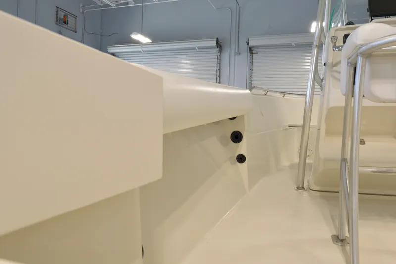 Slide: The Image of 2014 Sailfish 220 CC boat interior with sleek design and stainless steel railing. - 7