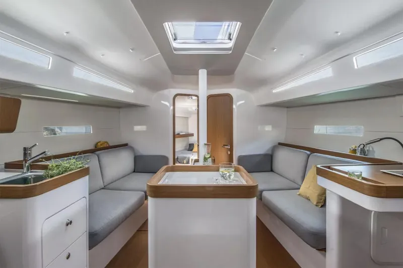 Slide: The Image of Manufacturer Provided Image: Interior of 2026 Beneteau First 36 yacht, featuring modern seating and sleek design. - 5