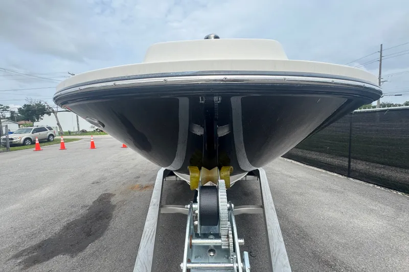 Slide: The Image of 2020 Sea Ray SPX 230 boat on trailer, front view, parked outdoors. - 13