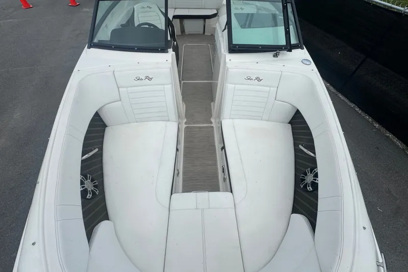 Slide: The Image of 2020 Sea Ray SPX 230 boat interior with white seating and gray flooring. - 36