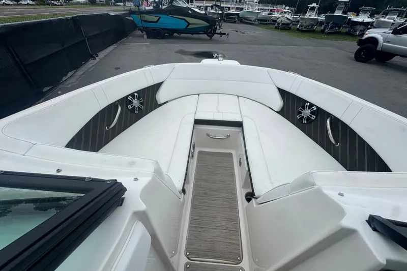 Slide: The Image of 2020 Sea Ray SPX 230 boat interior with white seating and modern design. - 33