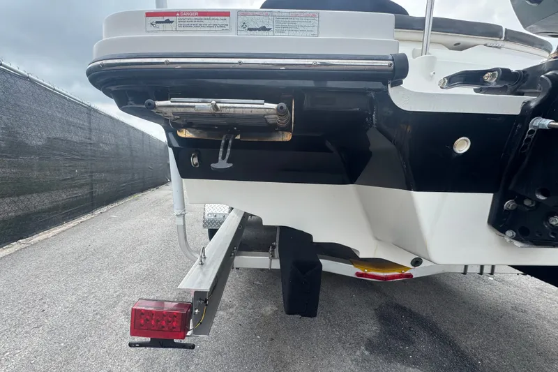 Slide: The Image of Rear view of a 2020 Sea Ray SPX 230 boat on a trailer. - 8
