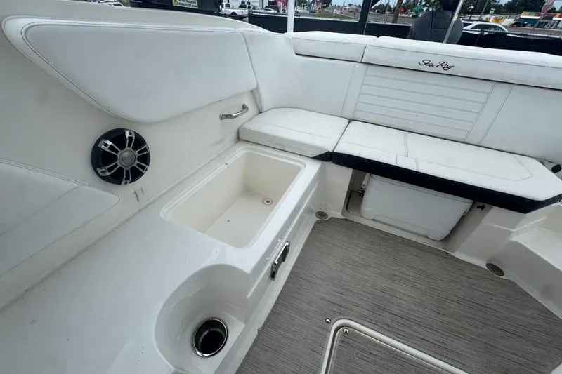 Slide: The Image of Interior of 2020 Sea Ray SPX 230 boat with seating and storage compartments. - 43