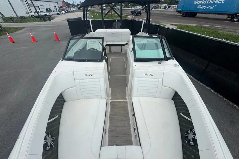 Slide: The Image of 2020 Sea Ray SPX 230 boat with white seating and open deck layout. - 37