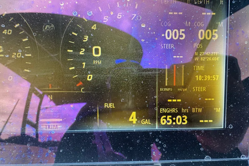 Slide: The Image of Dashboard of a 2020 Sea Ray SPX 230 boat showing RPM, fuel, and navigation data. - 32