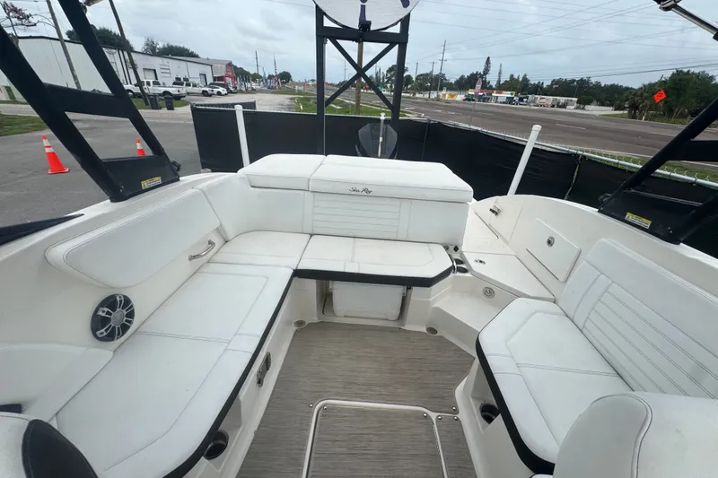 Slide: The Image of 2020 Sea Ray SPX 230 boat interior with white seating and spacious layout. - 42