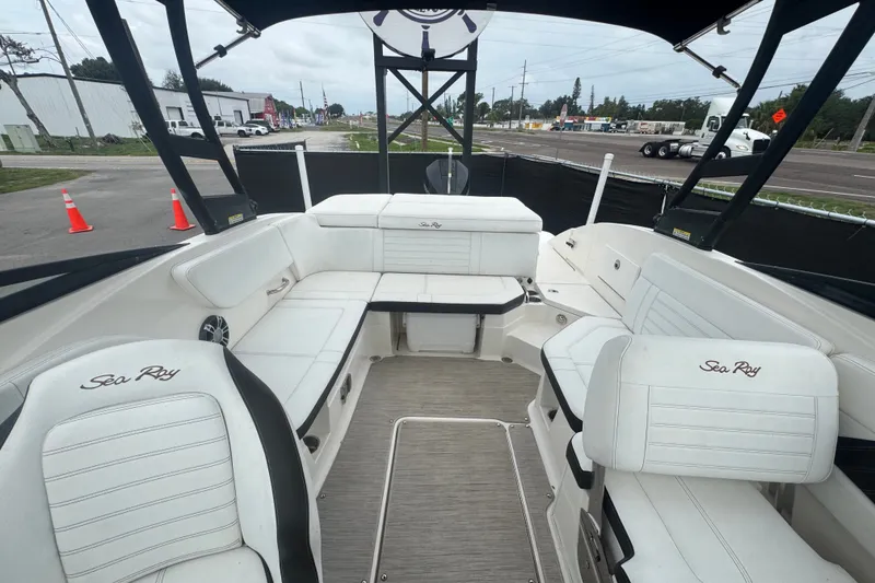 Slide: The Image of Interior of a 2020 Sea Ray SPX 230 boat with white seating and open layout. - 41