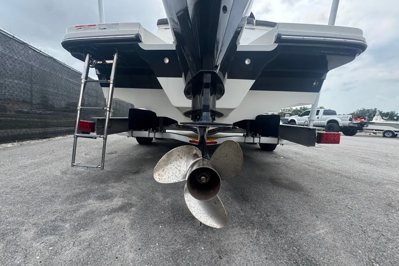 Slide: The Image of Rear view of a 2020 Sea Ray SPX 230 boat with visible propeller and ladder. - 6