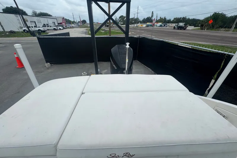 Slide: The Image of 2020 Sea Ray SPX 230 boat with Mercury engine, parked near a road under cloudy skies. - 51