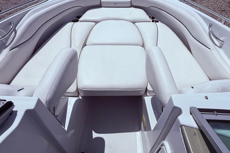 Slide: The Image of 2008 Crownline 220 EX boat interior with white cushioned seating and sleek design. - 11