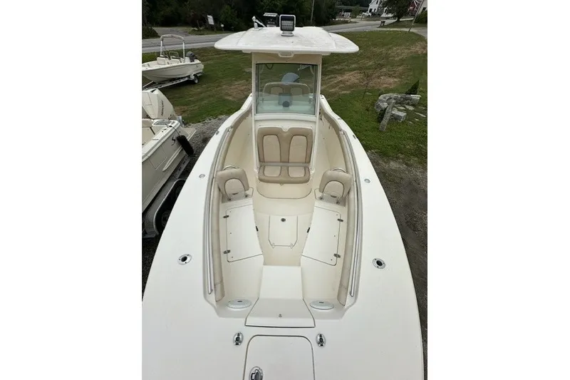 Slide: The Image of 2016 Scout 255 LXF boat with spacious seating and sleek design. - 11