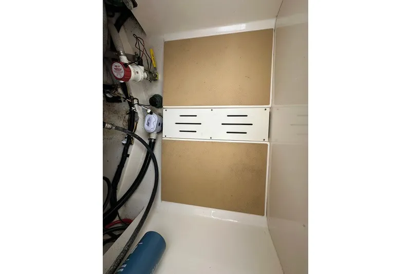 Slide: The Image of 2016 Scout 255 LXF boat interior showing equipment and storage area. - 19