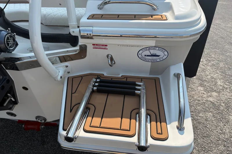 Slide: The Image of Rear view of a 2027 Pioneer 202 Islander boat with a foldable ladder. - 9