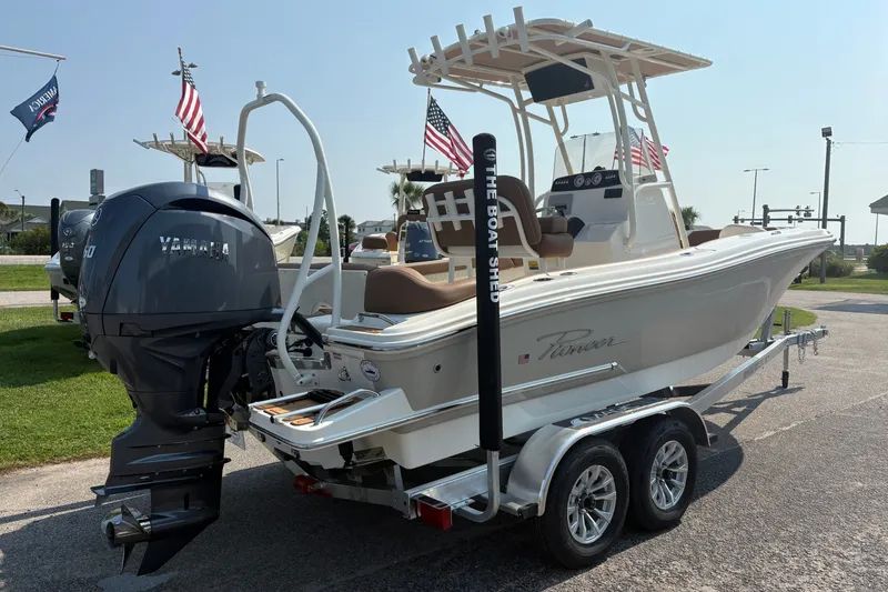 Slide: The Image of 2027 Pioneer 202 Islander boat on trailer with Yamaha engine, displayed outdoors. - 3