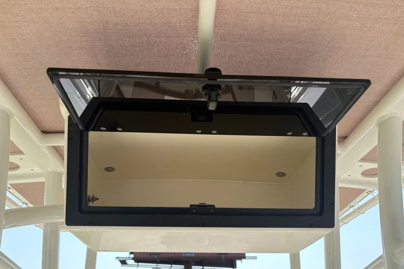 Slide: The Image of Open storage compartment on 2027 Pioneer 202 Islander boat, showcasing interior space. - 15
