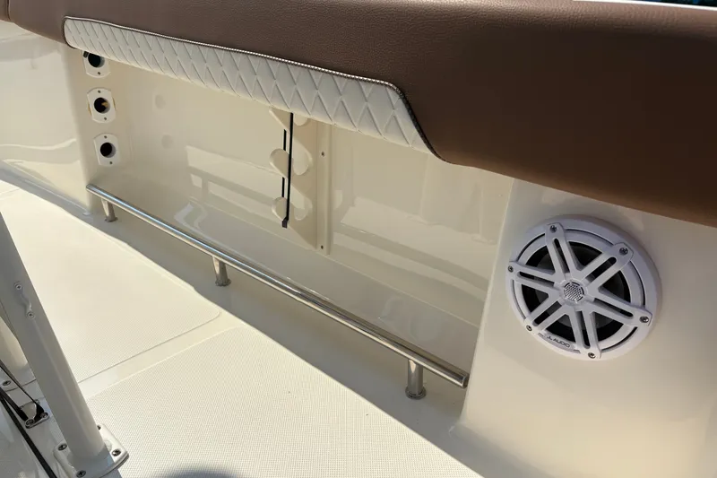 Slide: The Image of Interior of 2027 Pioneer 202 Islander boat with speaker and cushioned seating. - 19
