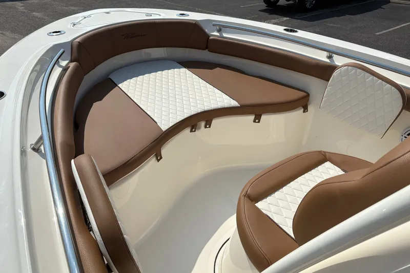 Slide: The Image of Luxurious seating on 2027 Pioneer 202 Islander boat with brown and white upholstery. - 27