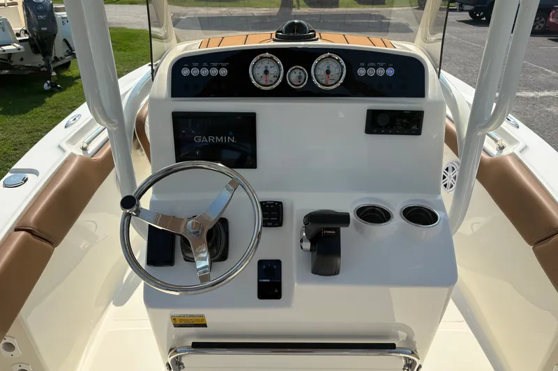 Slide: The Image of 2027 Pioneer 202 Islander boat dashboard with Garmin display and Yamaha controls. - 20