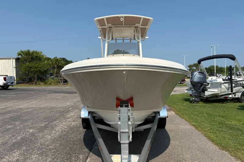 Slide: The Image of Front view of a 2027 Pioneer 202 Islander boat on a trailer, outdoors. - 6