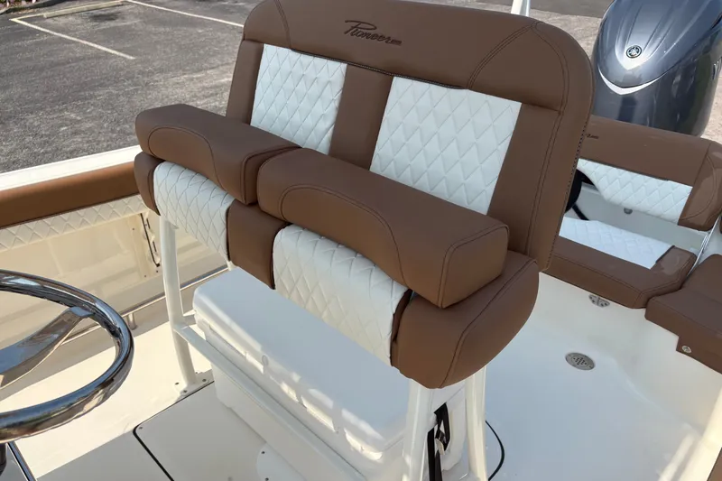 Slide: The Image of 2027 Pioneer 202 Islander boat seat with brown and white diamond-patterned upholstery. - 16