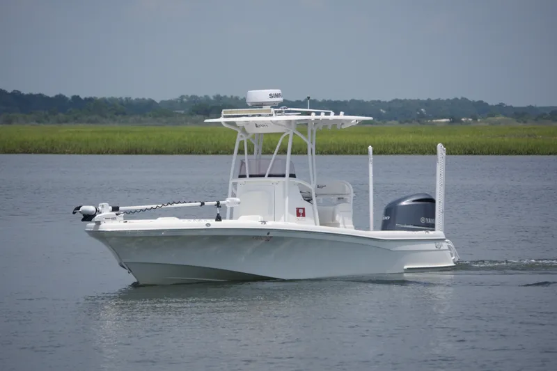 Slide: The Image of 2020 BlackJack 256 Coastal boat cruising on a calm river with lush greenery. - 4